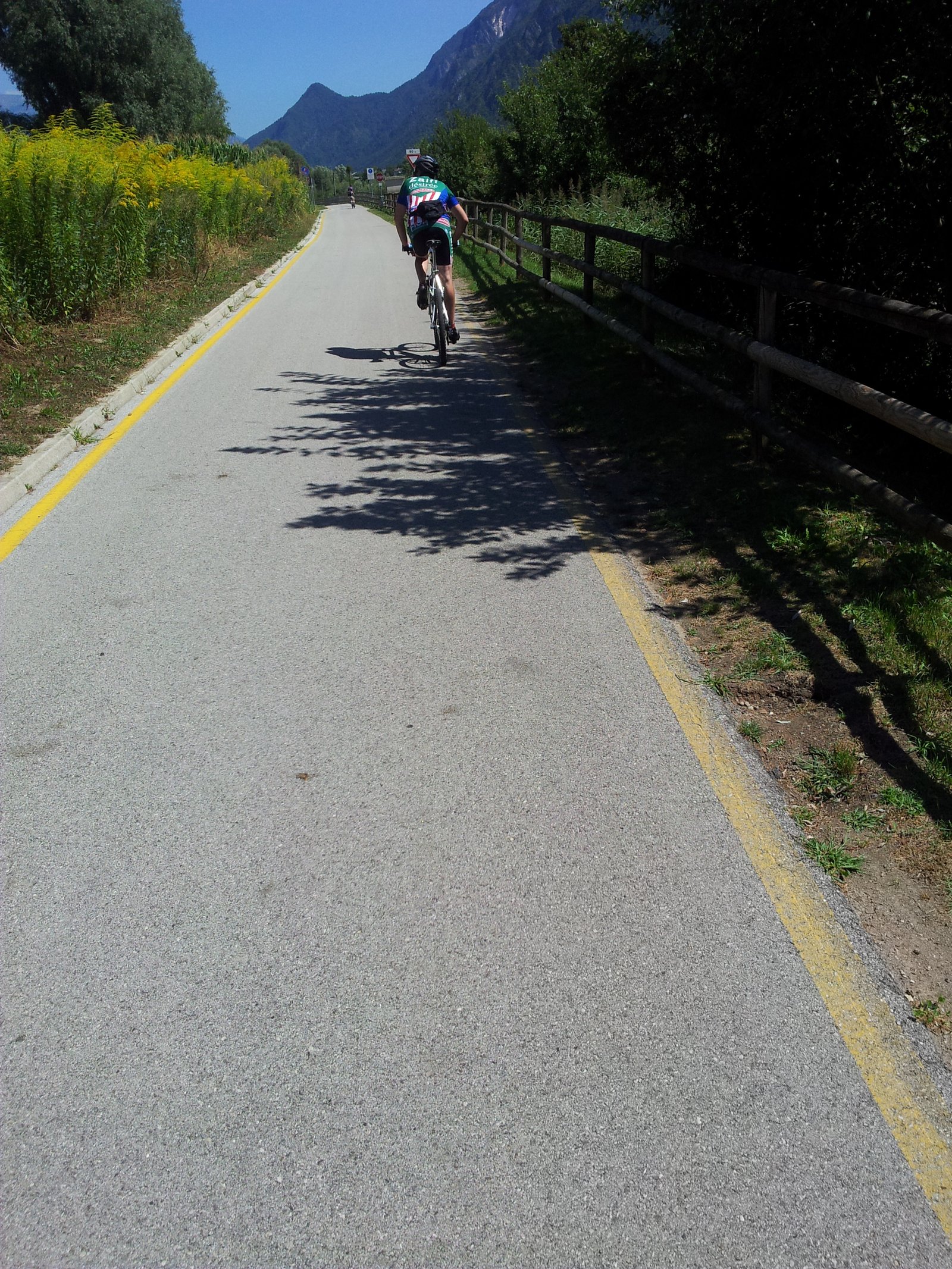 Cyclists on the Valsugana cycle path along the river Brenta